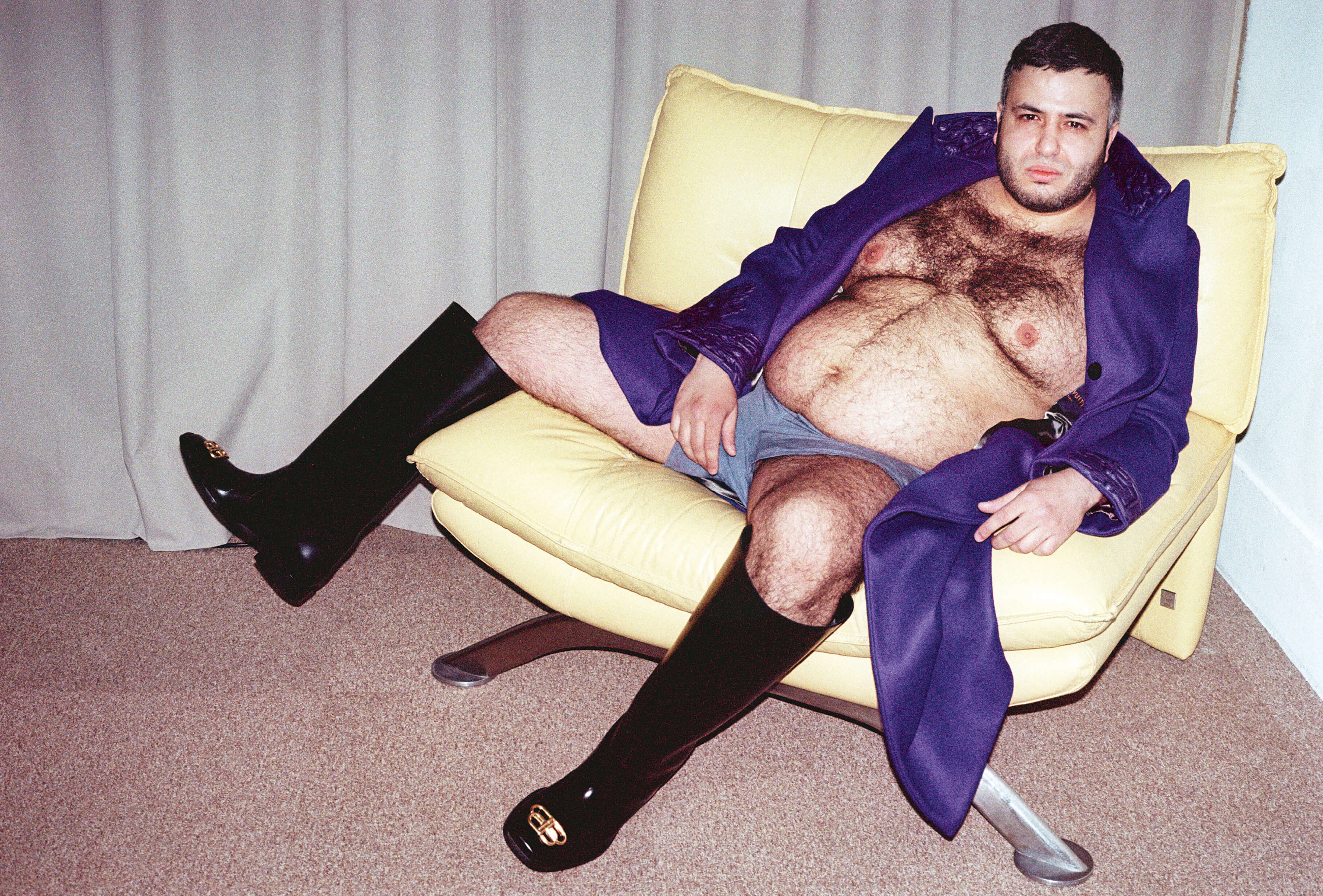 MASSES Magazine No. 12 – Aux Armes et Cætera, Photography by Matthias Vriens – Mehdi Aboualiten wearing Louis Vuitton by Virgil Abloh Autumn/Winter 2019 purple coat and Balenciaga by Demna Gvasalia Autumn/Winter 2019 rain BB boots — 2019