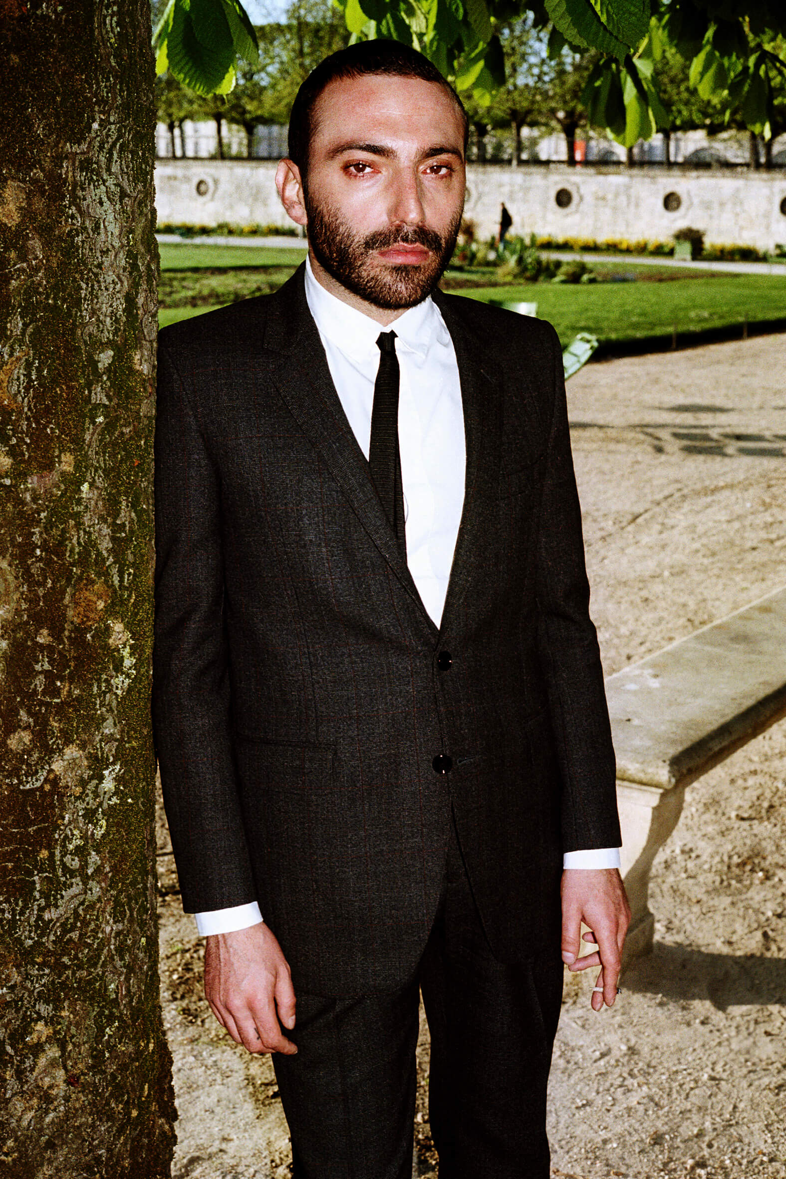 MASSES Magazine No. 12 – Aux Armes et Cætera, Photography by Matthias Vriens – Pierre-Ange Carlotti wearing Celine by Hedi Slimane Autumn/Winter 2019 jacket, shirt, trousers and tie — 2019
